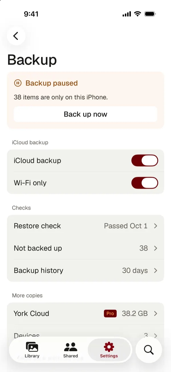 The backup screen with a banner that the backup is paused and 38 items are only on this iPhone, with Back up now