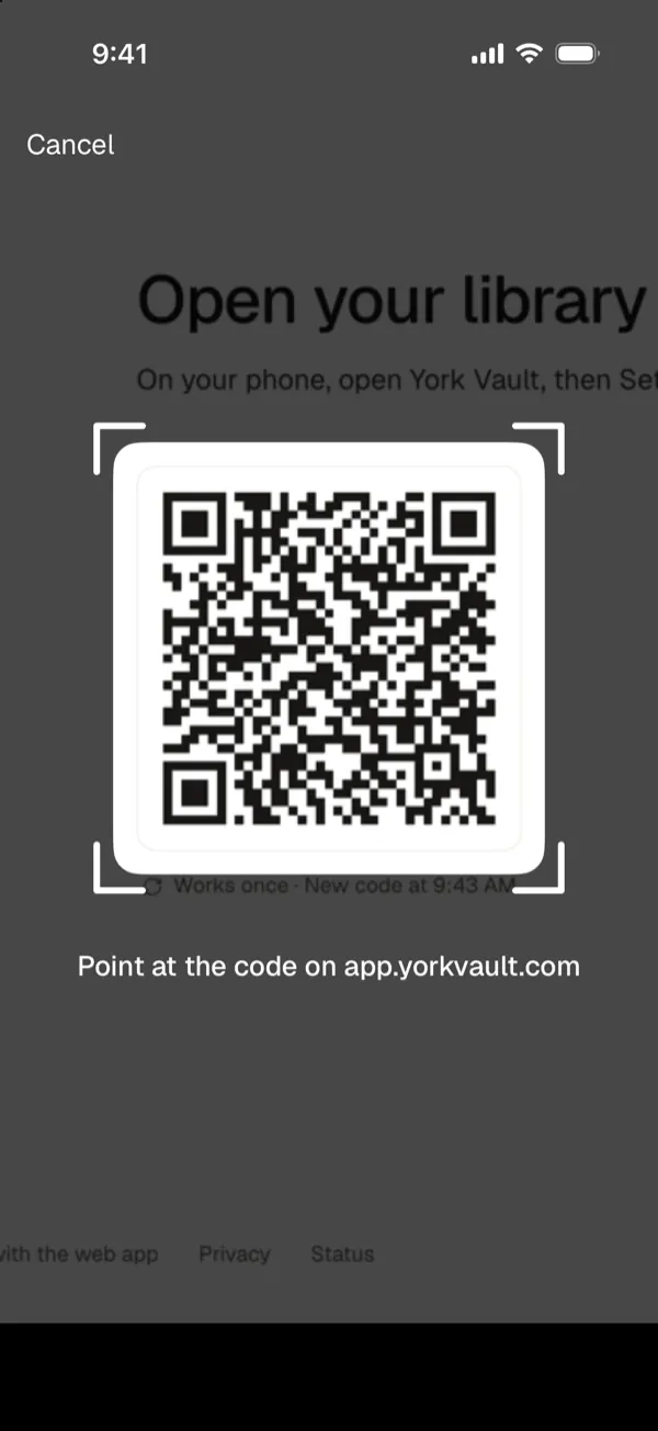 The phone camera pointed at the QR code on app.yorkvault.com